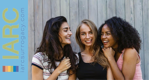 three IARC surrogates smiling with each other