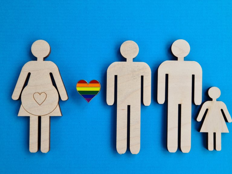 cutouts of an LGBTQ surrogate family and a surrogate