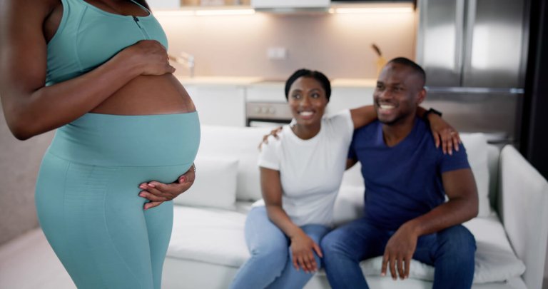 two intended parents with their surrogate