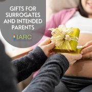 an intended parent giving a gift to their surrogate
